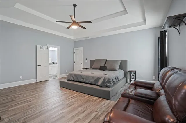 a bedroom with a bed and a couch