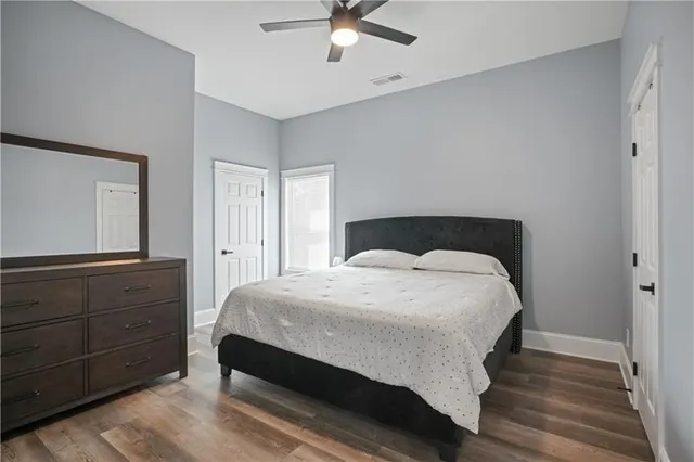 a living room with furniture a fireplace and a large window