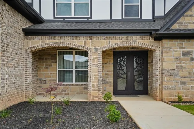 a front view of a house with garden