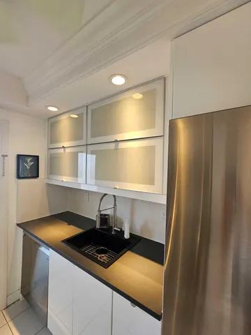 a kitchen with a stove and a sink
