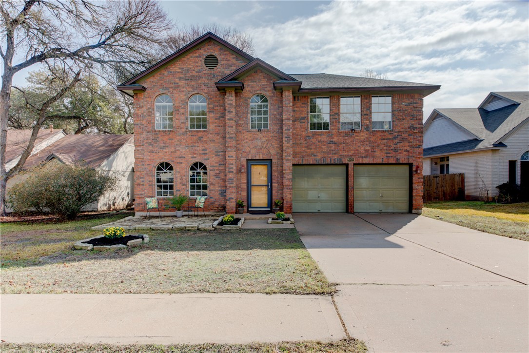 8009 Cutler Ridge Place Austin, TX 78749 - Photo 1 of 1 a front view of a house with garden