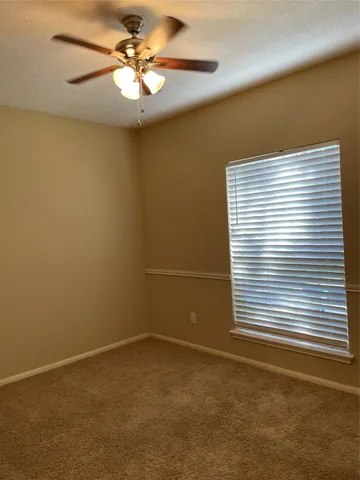 a kitchen with granite countertop wood cabinets stainless steel appliances and sink