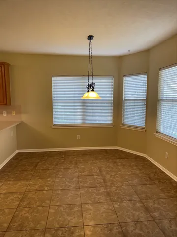 a bathroom with a toilet and a bath tub