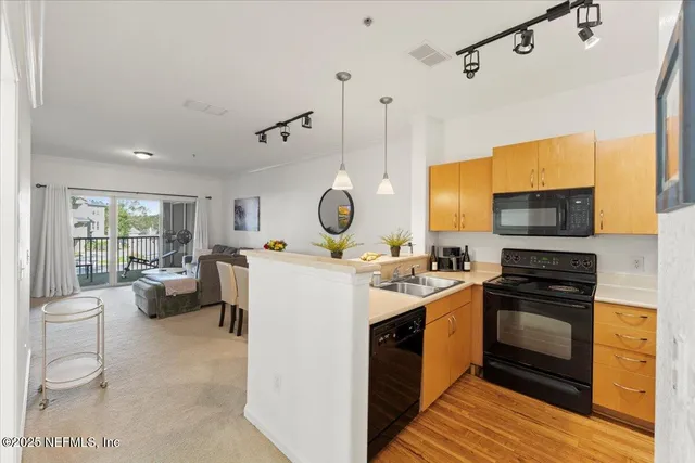 a front view of a building with a garden