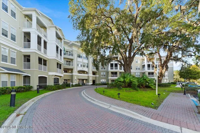 a view of a building with a yard