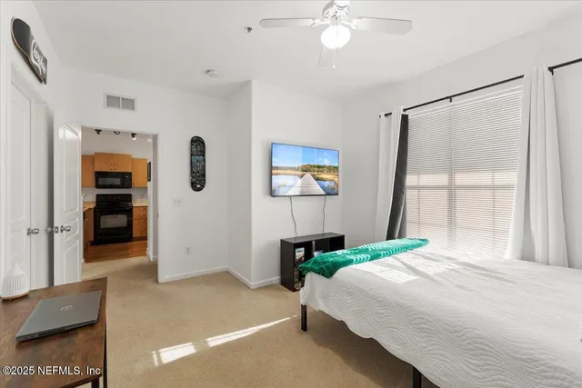 a bathroom with a double vanity sink toilet and shower