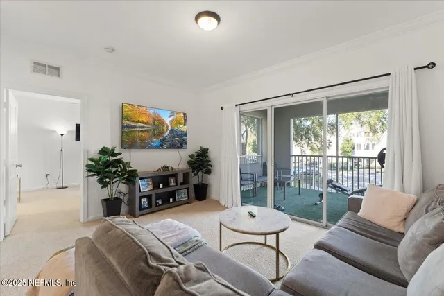 a kitchen with a sink a counter appliances and cabinets