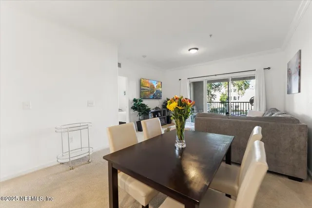 a kitchen with stainless steel appliances kitchen island granite countertop a refrigerator a stove and a sink with wooden floor