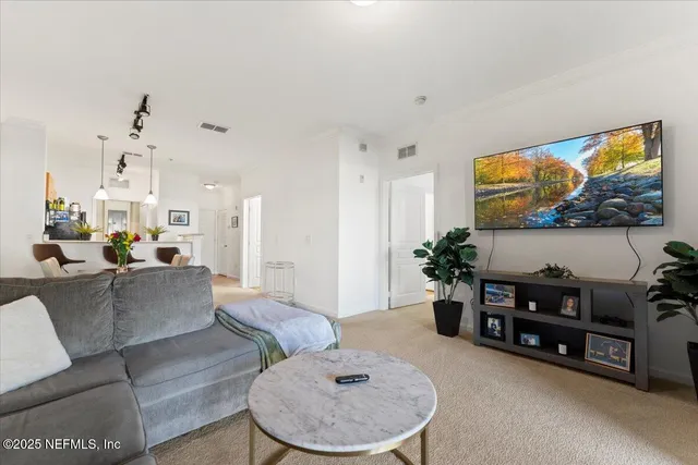 a bathroom with a sink vanity mirror and toilet