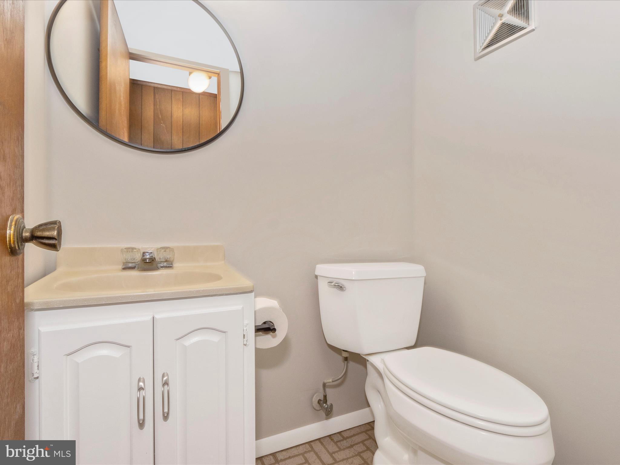 19453 Olney Mill Road Olney, MD 20832 - Photo 29 of 41 a bathroom with a toilet and a sink