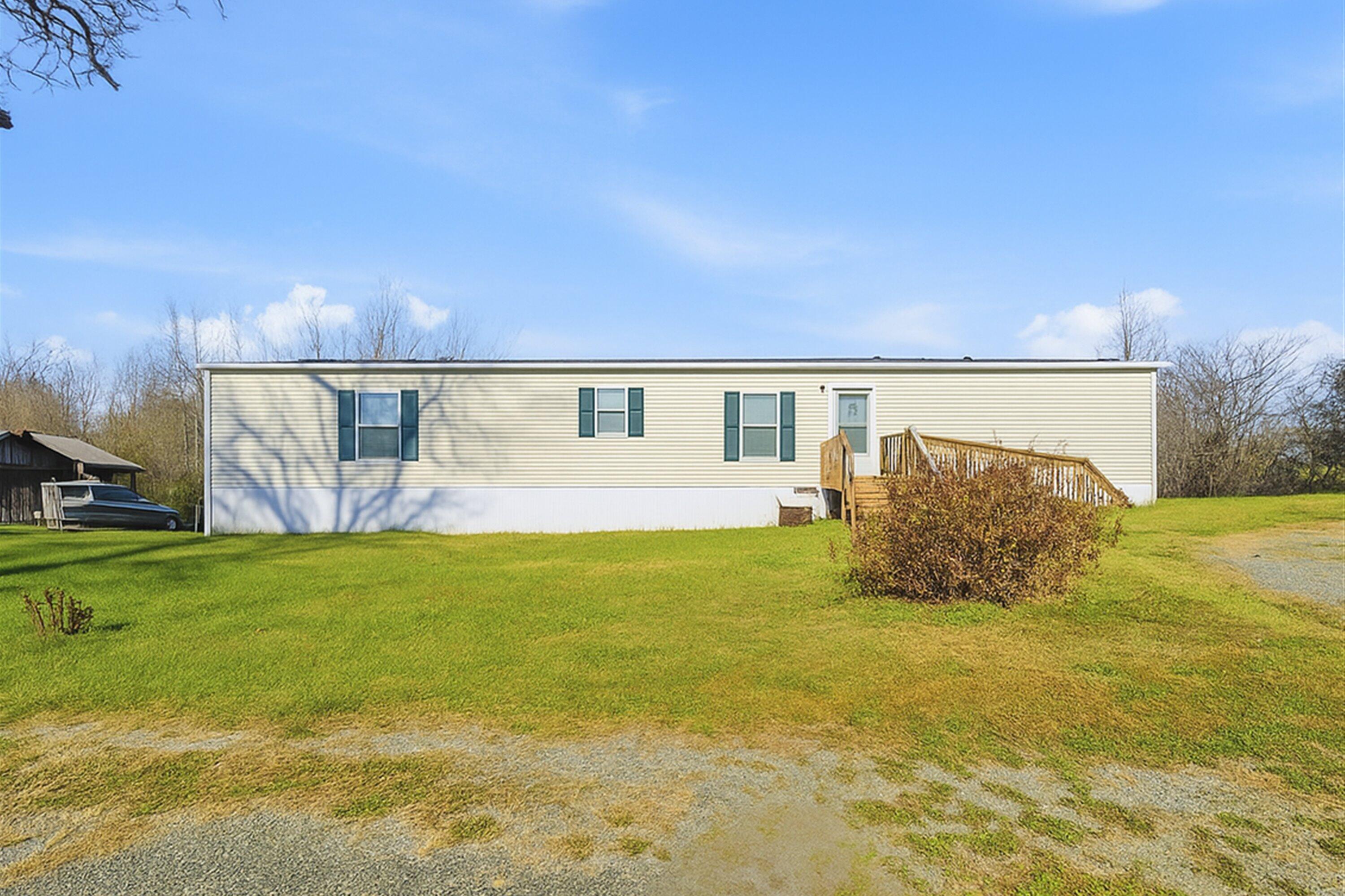 a swimming pool with an outdoor space and seating area