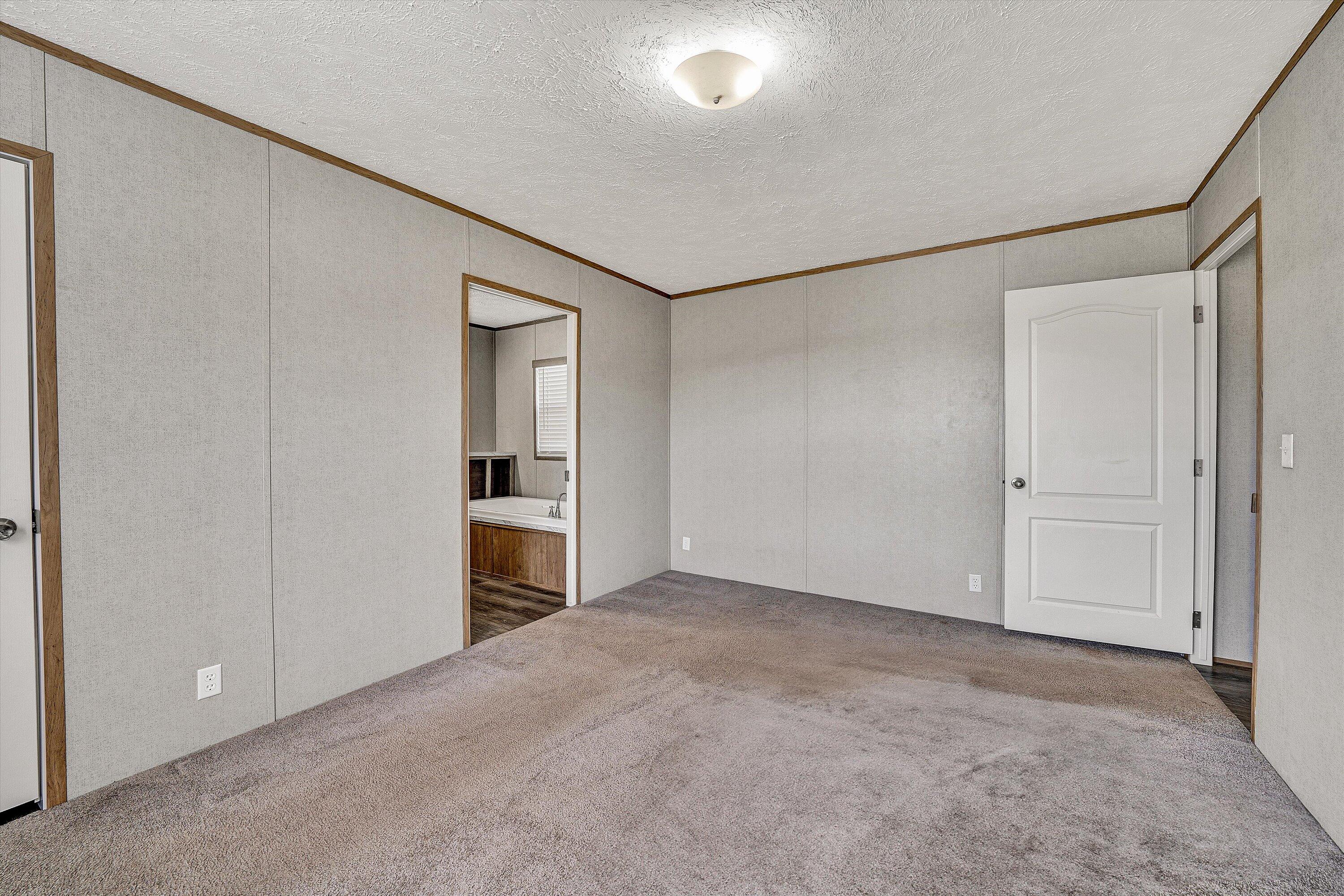 1405 Doe Run Road Rocky Mount, VA 24151 - Photo 15 of 27 an empty room with a bathroom and a sink