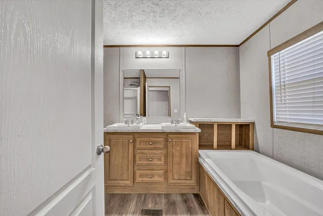 a white toilet sitting next to a bathroom sink