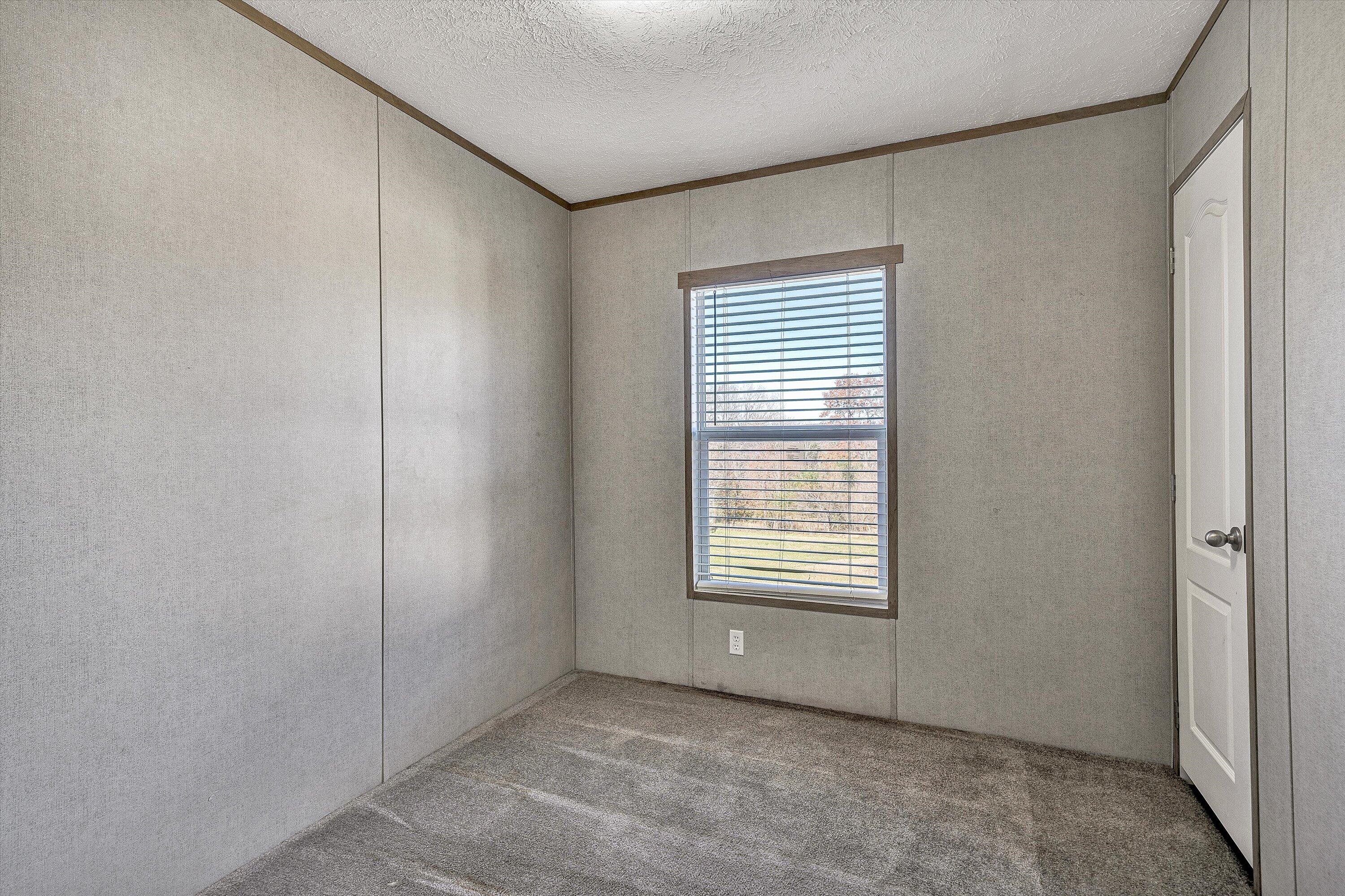 1405 Doe Run Road Rocky Mount, VA 24151 - Photo 19 of 27 a view of an empty room with a window
