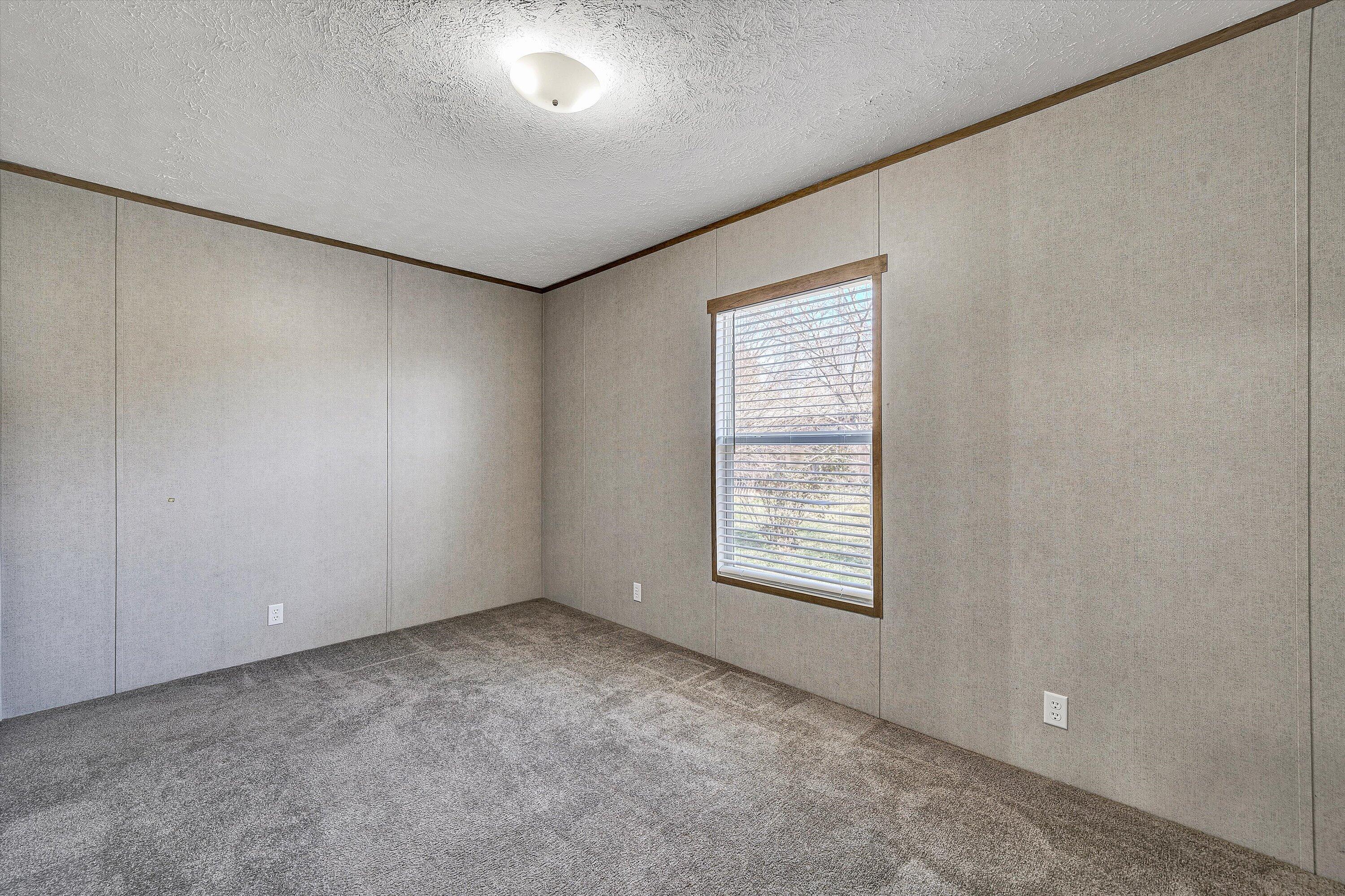 1405 Doe Run Road Rocky Mount, VA 24151 - Photo 22 of 27 an empty room with a window