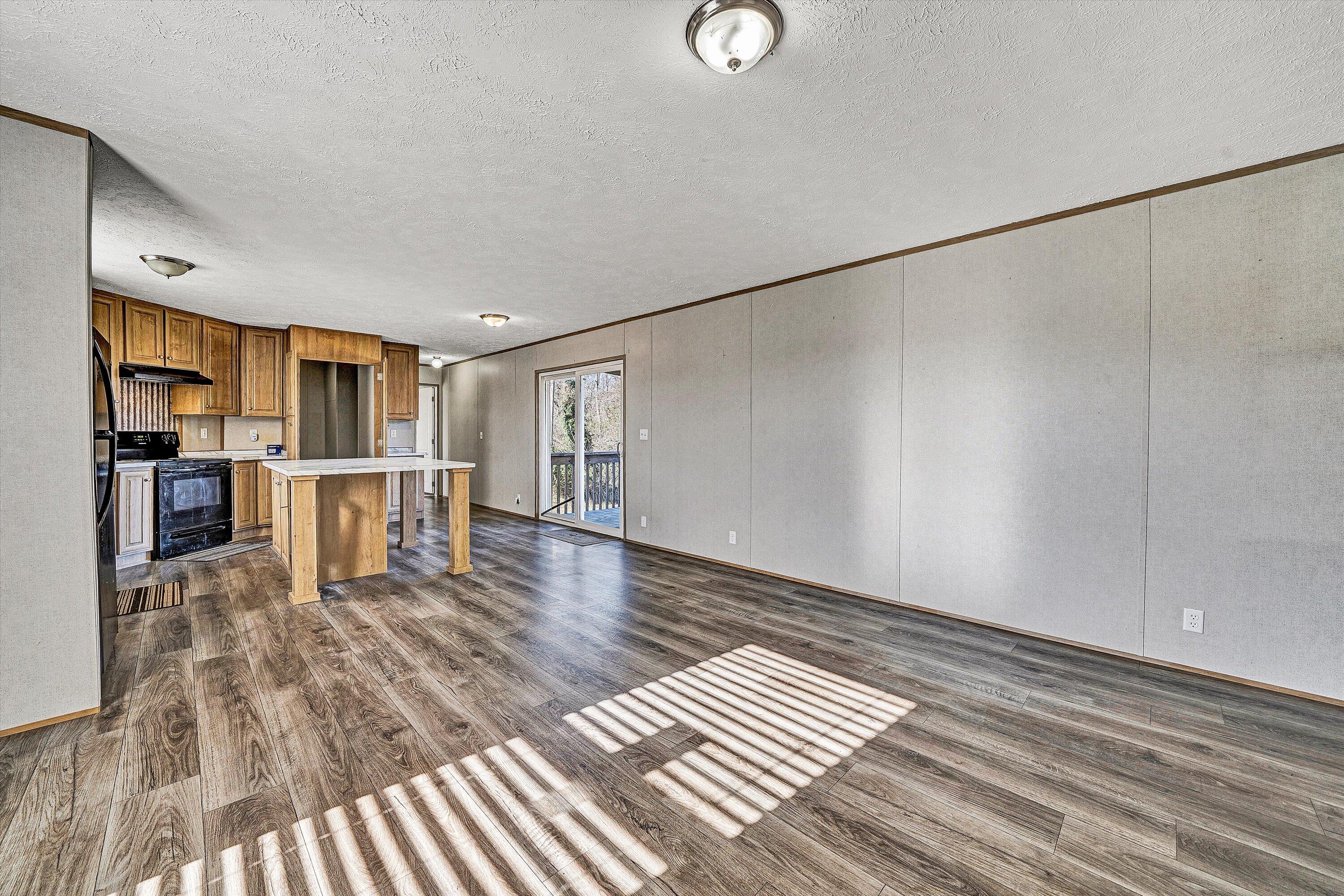 1405 Doe Run Road Rocky Mount, VA 24151 - Photo 5 of 27 a view of kitchen with furniture and wooden floor