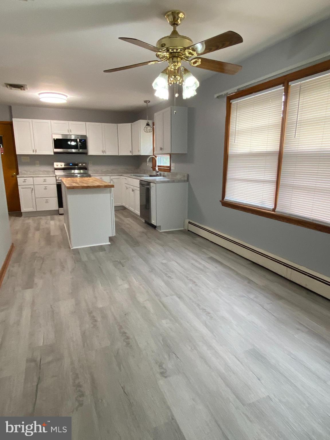 13343 Keener Road Hagerstown, MD 21742 - Photo 13 of 56 a kitchen with stainless steel appliances granite countertop a stove a sink and a microwave