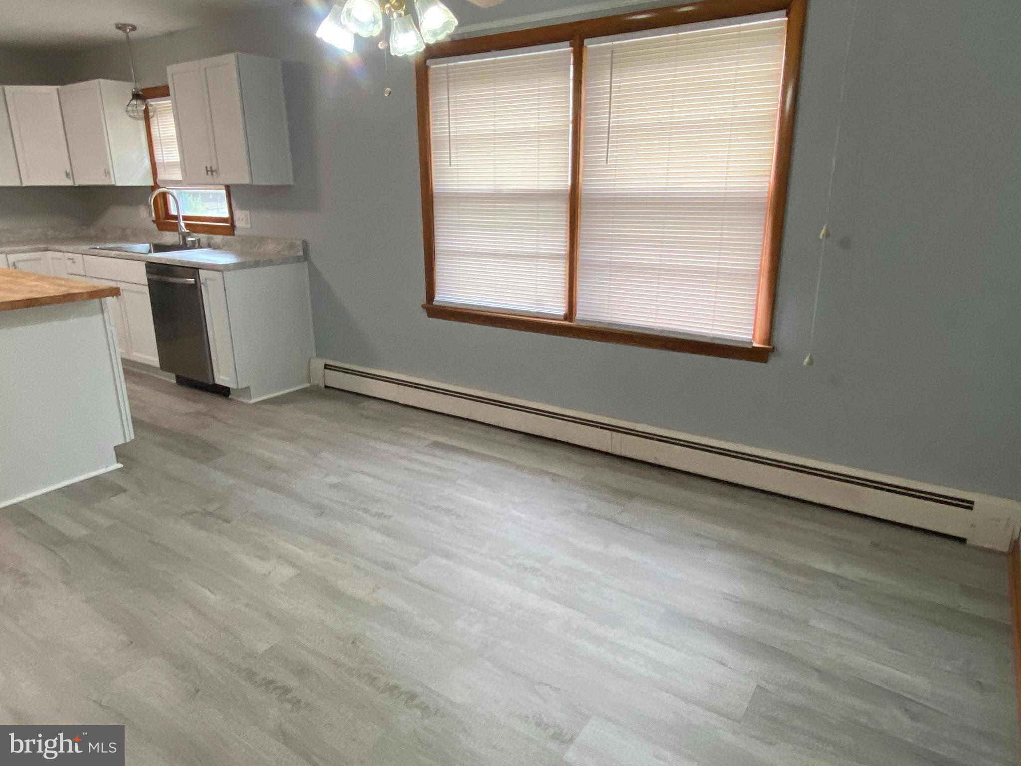 13343 Keener Road Hagerstown, MD 21742 - Photo 16 of 56 a view of a kitchen with a sink cabinets and a window