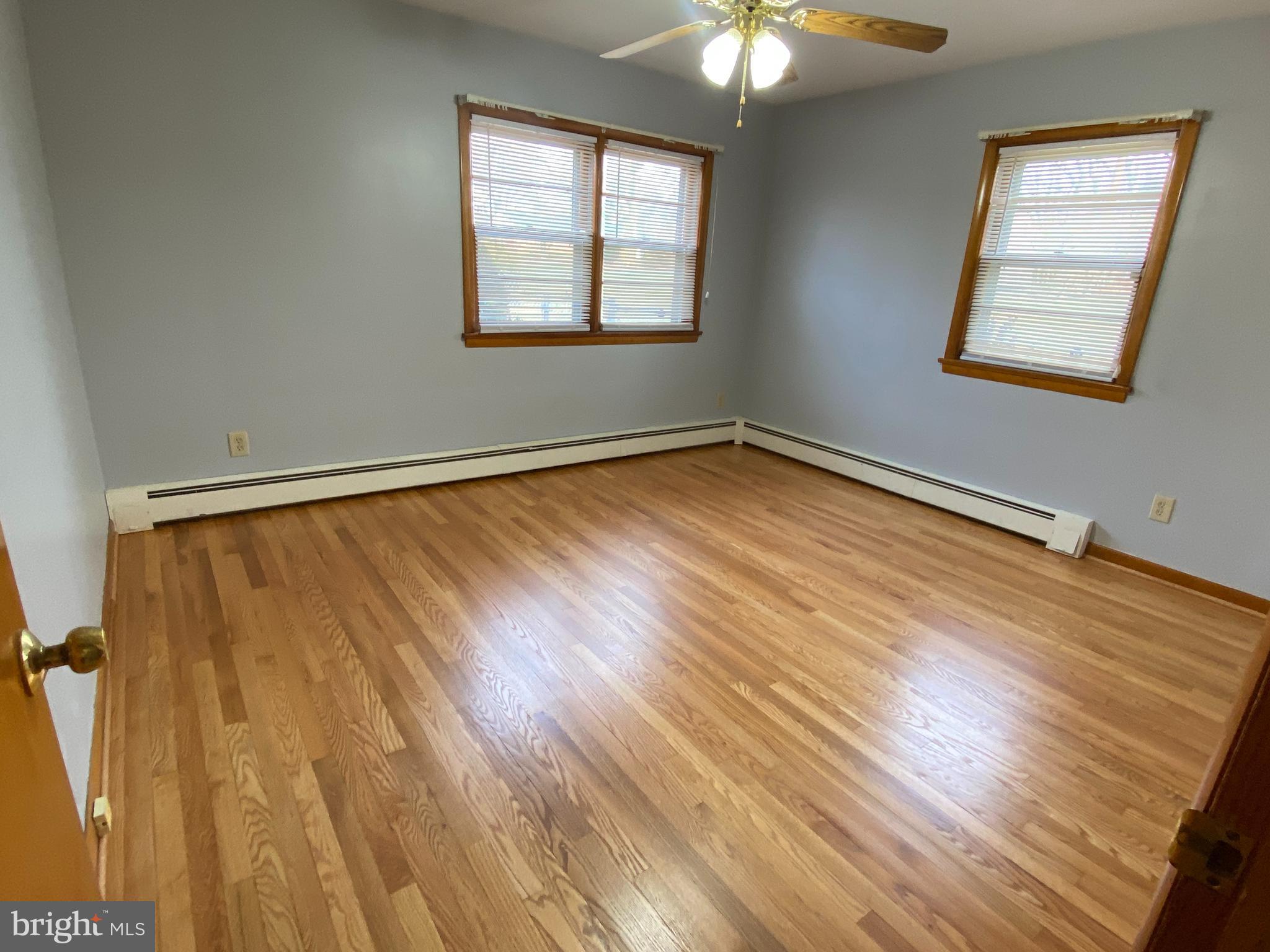 13343 Keener Road Hagerstown, MD 21742 - Photo 29 of 56 a view of an empty room with wooden floor and a window