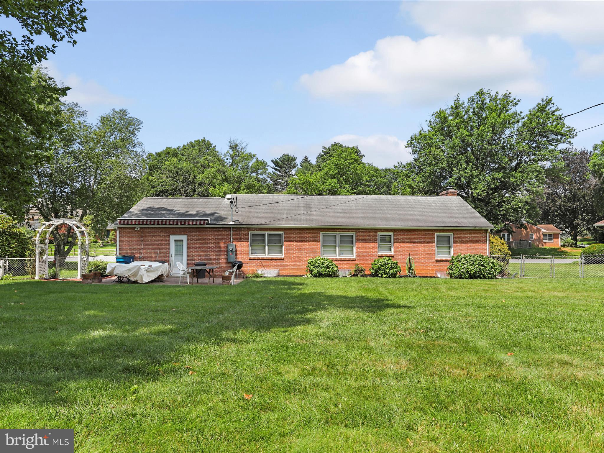 13343 Keener Road Hagerstown, MD 21742 - Photo 40 of 56 a front view of a house with a garden and trees