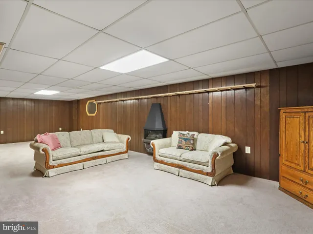 an aerial view of a residential houses with yard