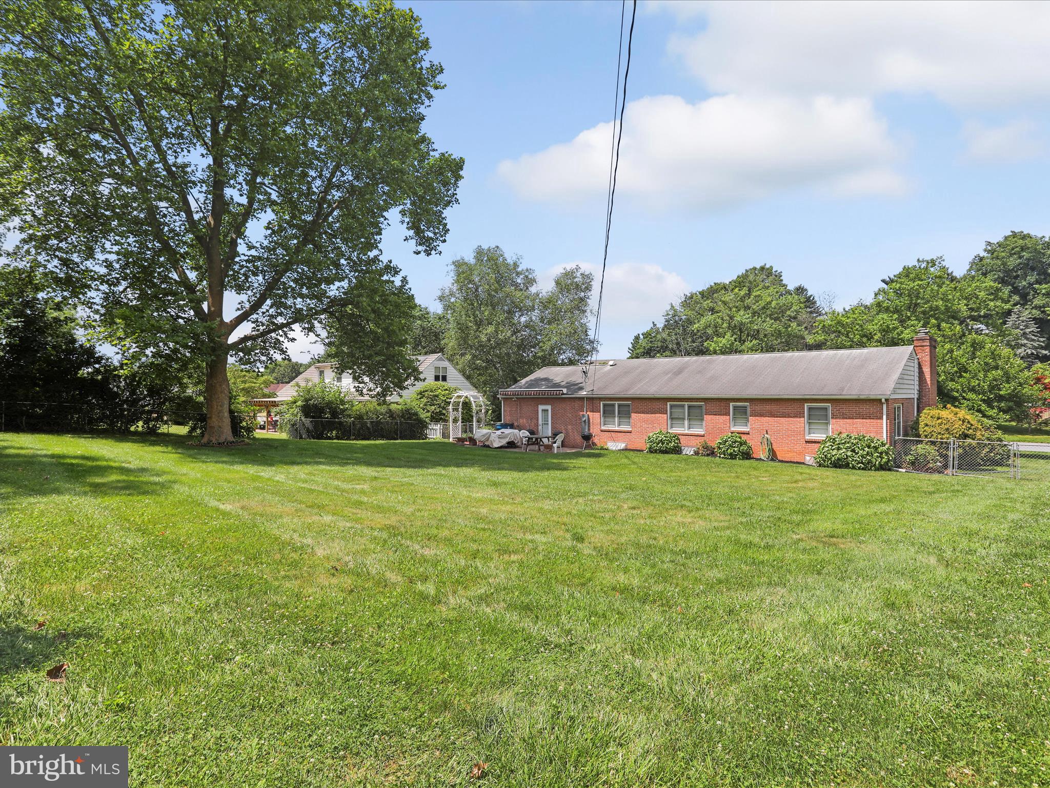 13343 Keener Road Hagerstown, MD 21742 - Photo 42 of 56 a view of a house with a big yard potted plants and large tree