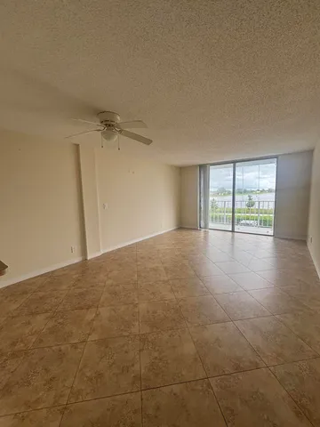 a front view of a residential apartment building with a yard