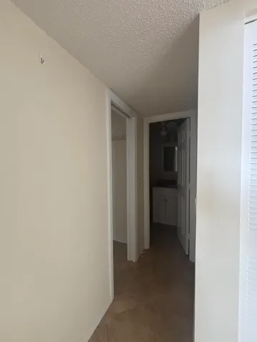 a view of an empty room and closet