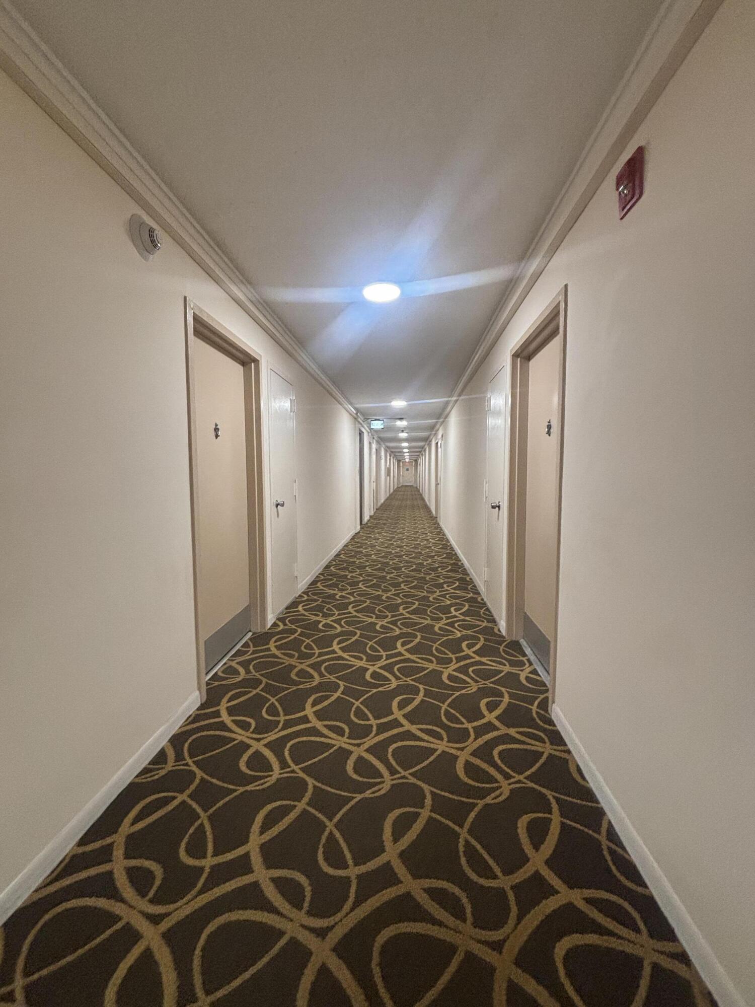 480 Executive Center Drive, Unit 2C West Palm Beach, FL 33401 - Photo 7 of 18 a view of wooden floor