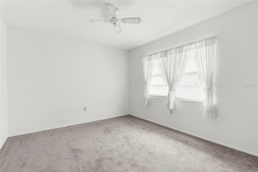 22249 Powell Road Brooksville, FL 34601 - Photo 11 of 43 an empty room with a window