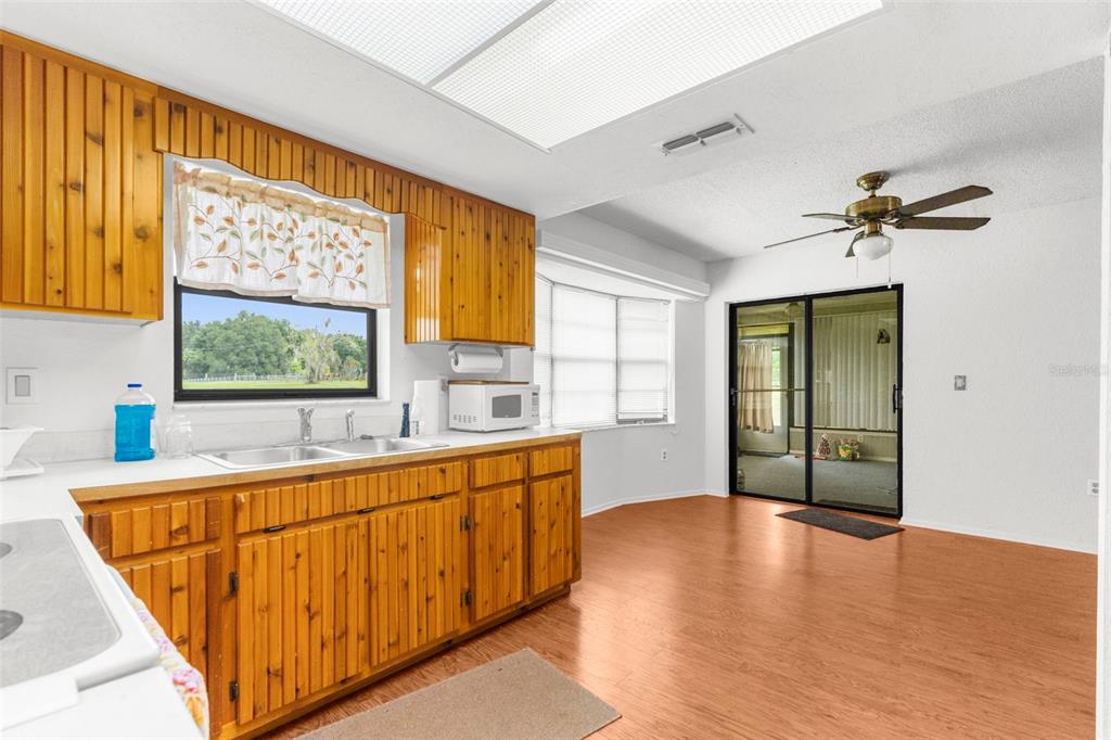 22249 Powell Road Brooksville, FL 34601 - Photo 13 of 43 a view of a kitchen with a sink and a window
