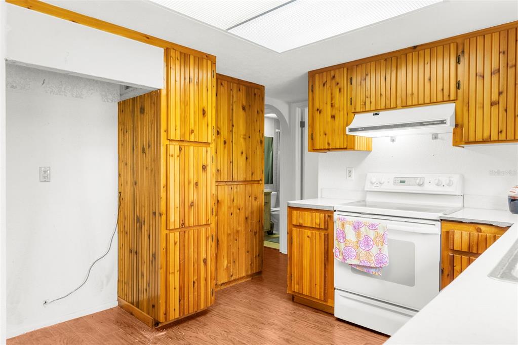 22249 Powell Road Brooksville, FL 34601 - Photo 15 of 43 a bathroom with a granite countertop sink and a mirror