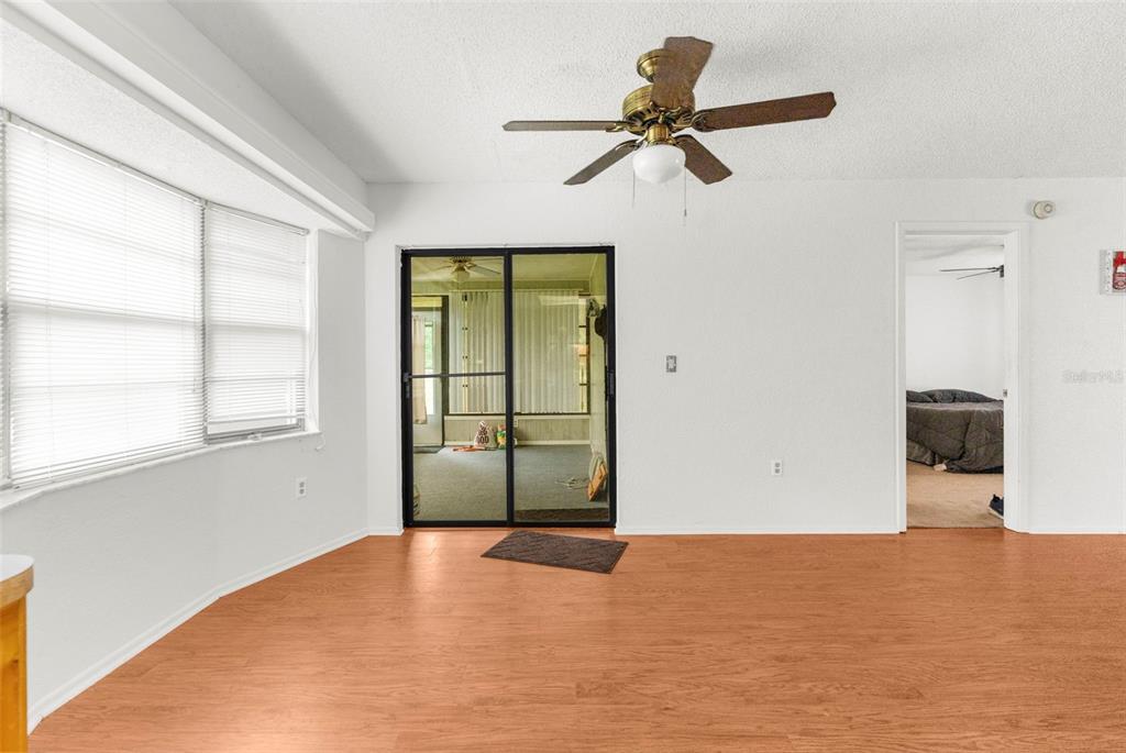 22249 Powell Road Brooksville, FL 34601 - Photo 18 of 43 a view of a room with a ceiling fan and a window