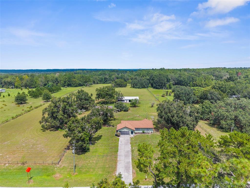 22249 Powell Road Brooksville, FL 34601 - Photo 2 of 43 a view of a lake with a mountain in the back