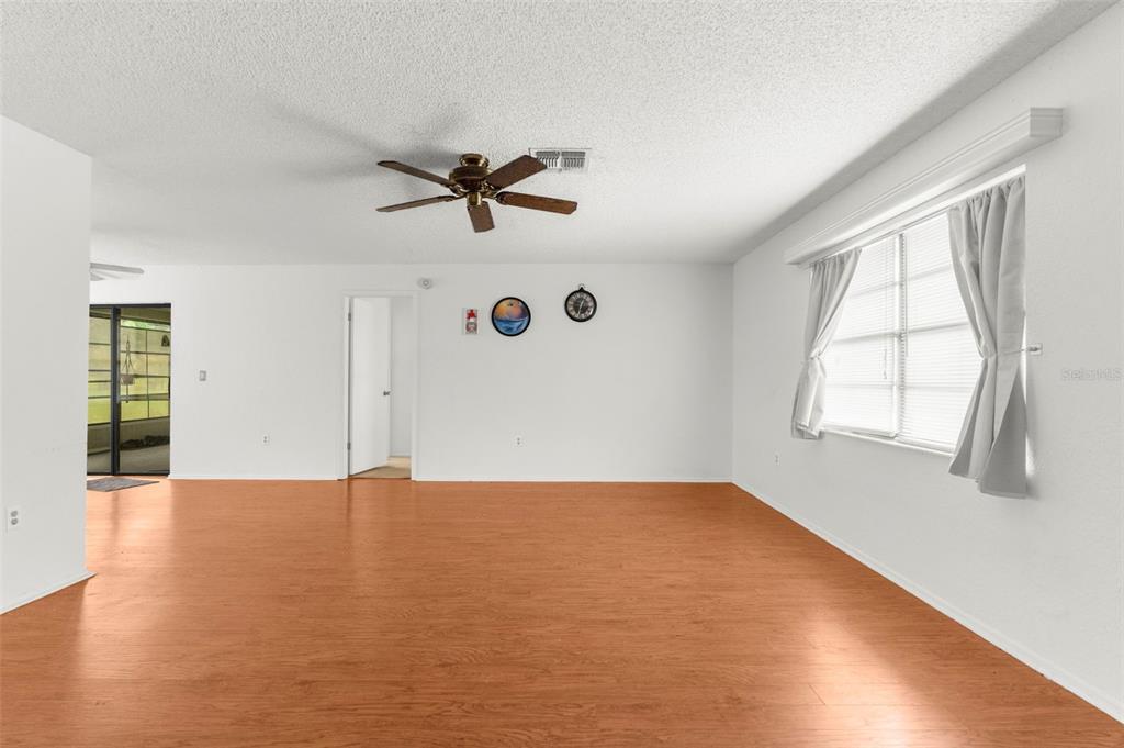 22249 Powell Road Brooksville, FL 34601 - Photo 23 of 43 an empty room with windows and fan