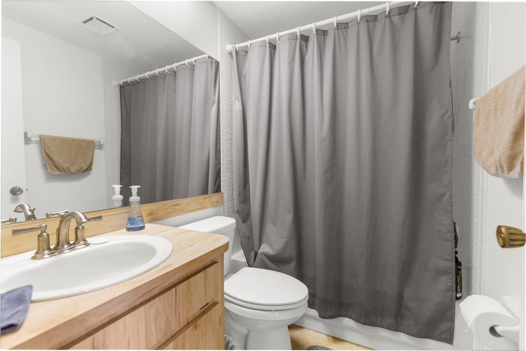 22249 Powell Road Brooksville, FL 34601 - Photo 24 of 43 a bathroom with a sink a toilet and a mirror