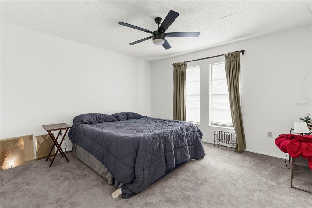 22249 Powell Road Brooksville, FL 34601 - Photo 25 of 43 a bed room with a bed and a window