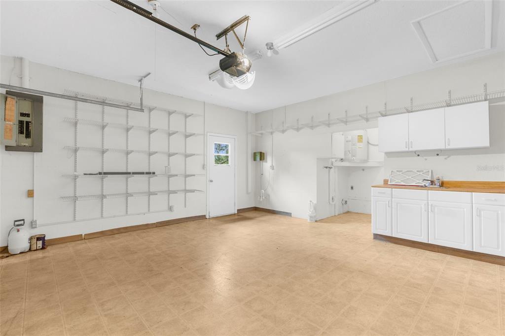 22249 Powell Road Brooksville, FL 34601 - Photo 29 of 43 a view of a kitchen with a sink and cabinets