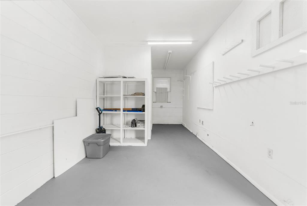 22249 Powell Road Brooksville, FL 34601 - Photo 38 of 43 a view of a room with racks on the wall