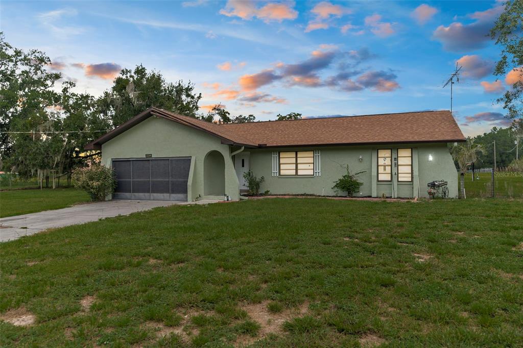 22249 Powell Road Brooksville, FL 34601 - Photo 42 of 43 a view of a house with a yard