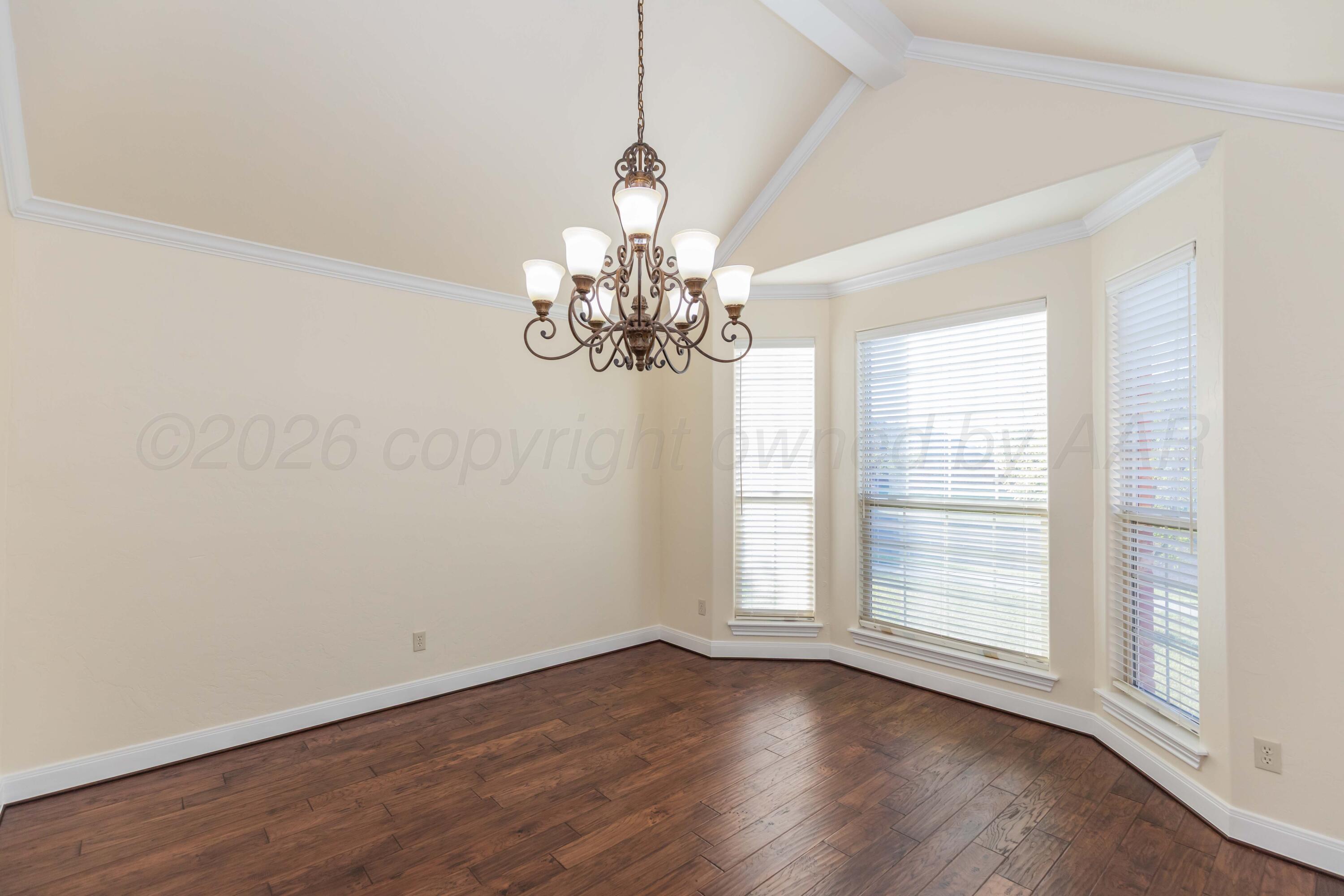 7718 Pinnacle Drive Amarillo, TX 79119 - Photo 25 of 66 a view of a chandelier in a room