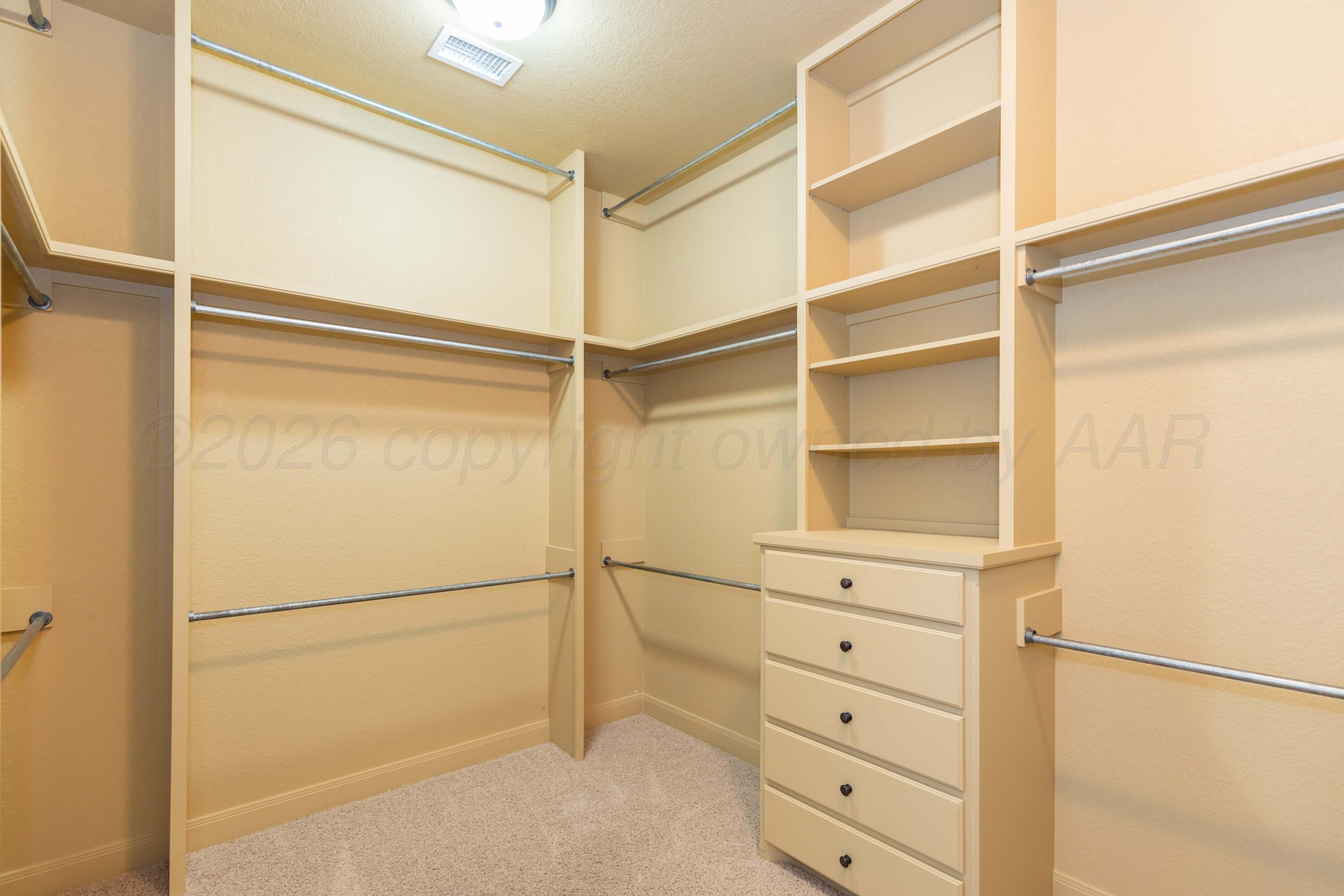 7718 Pinnacle Drive Amarillo, TX 79119 - Photo 34 of 66 a view of an empty walk in closet