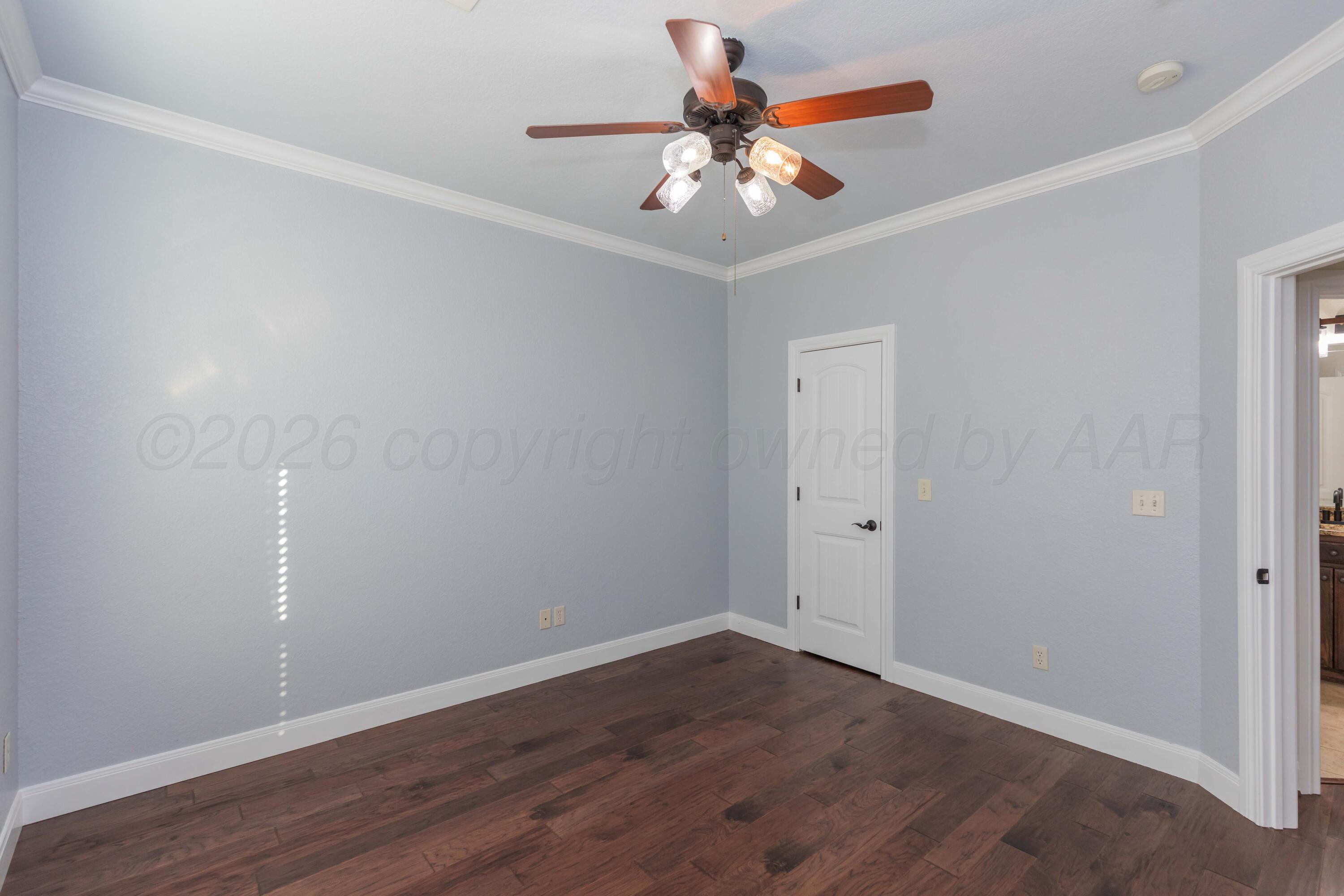 7718 Pinnacle Drive Amarillo, TX 79119 - Photo 47 of 66 a view of an empty room with wooden floor