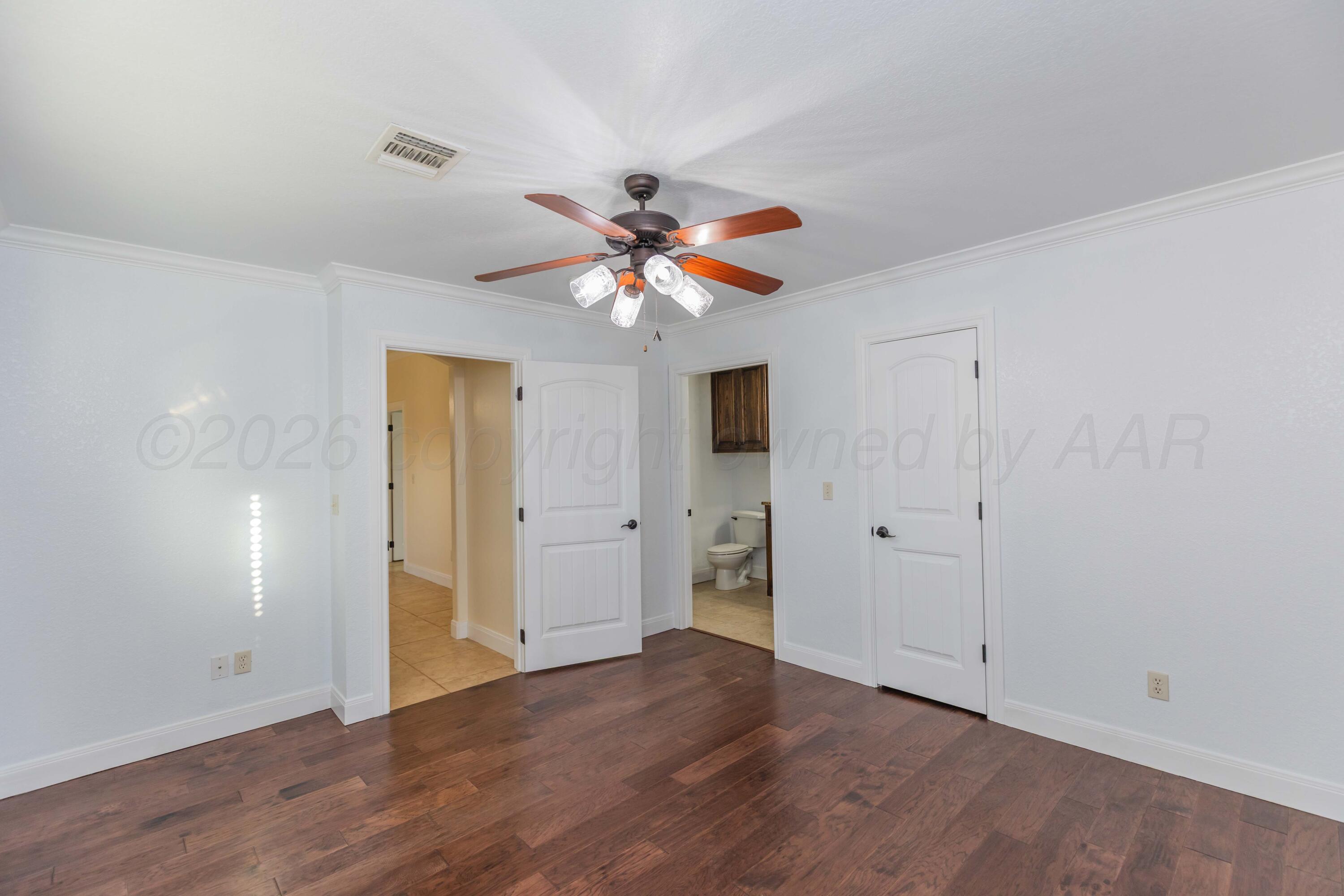 7718 Pinnacle Drive Amarillo, TX 79119 - Photo 49 of 66 a view of an empty room with chandelier fan