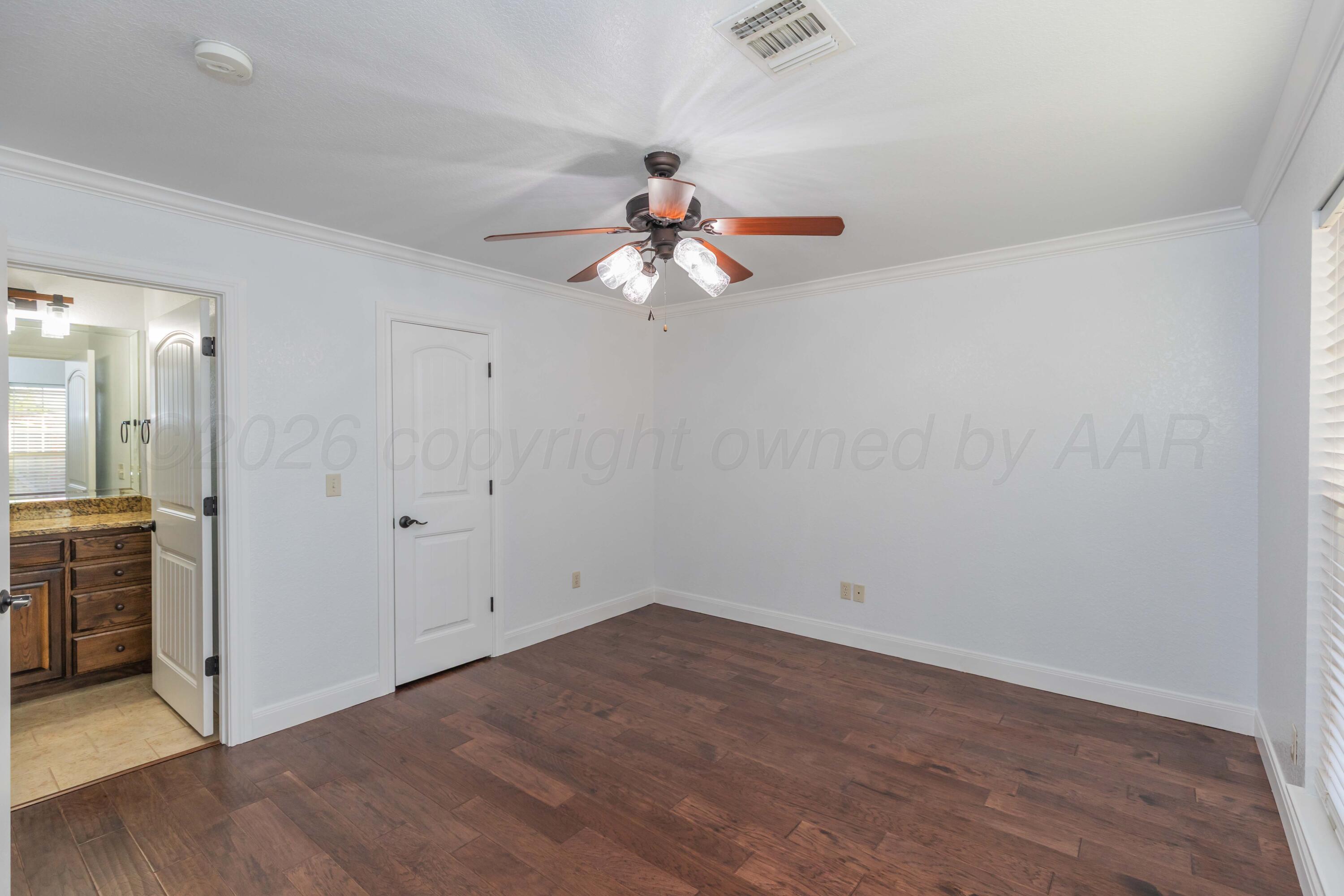 7718 Pinnacle Drive Amarillo, TX 79119 - Photo 50 of 66 wooden floor in an empty room with a window