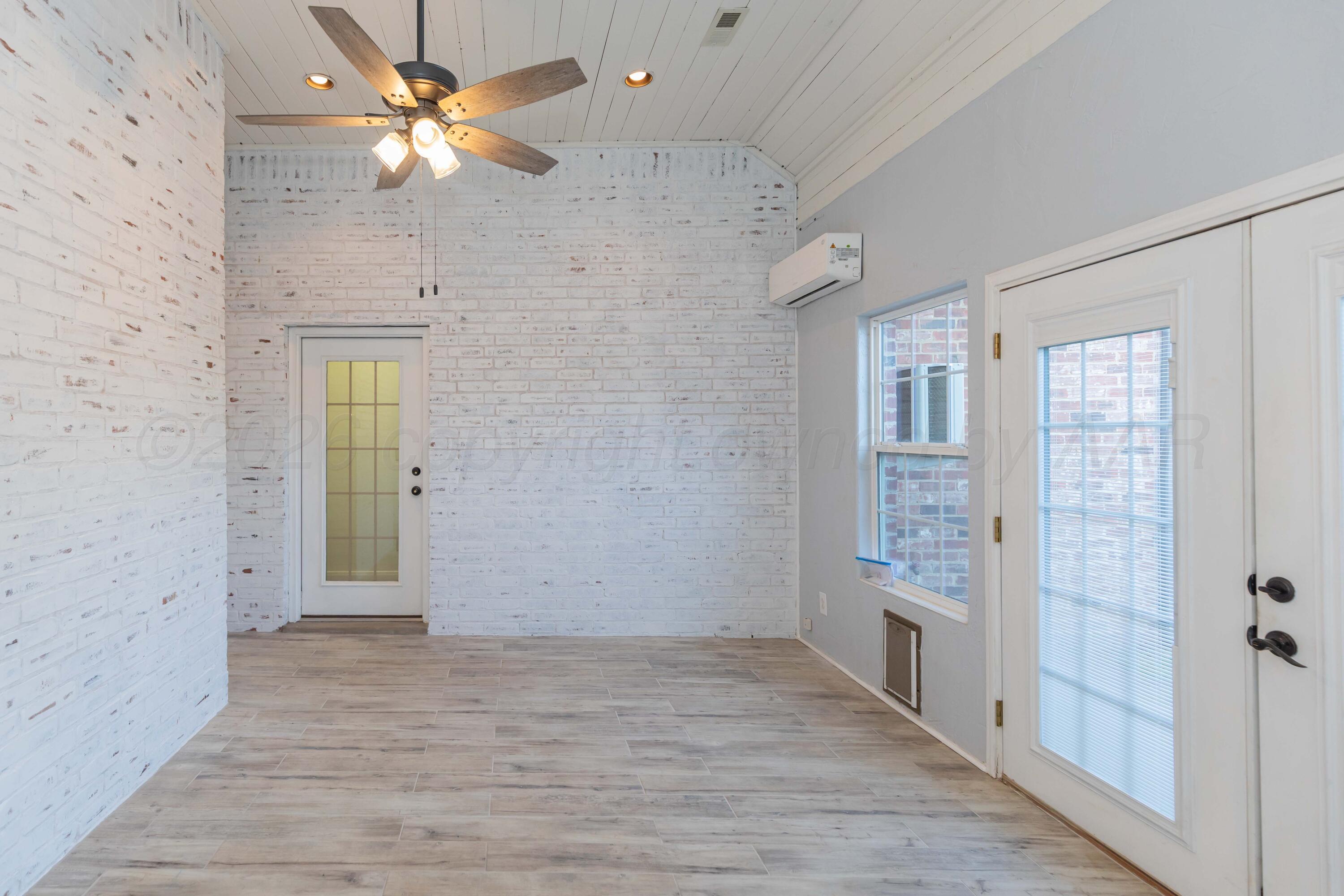 7718 Pinnacle Drive Amarillo, TX 79119 - Photo 57 of 66 wooden floor in an empty room with a window