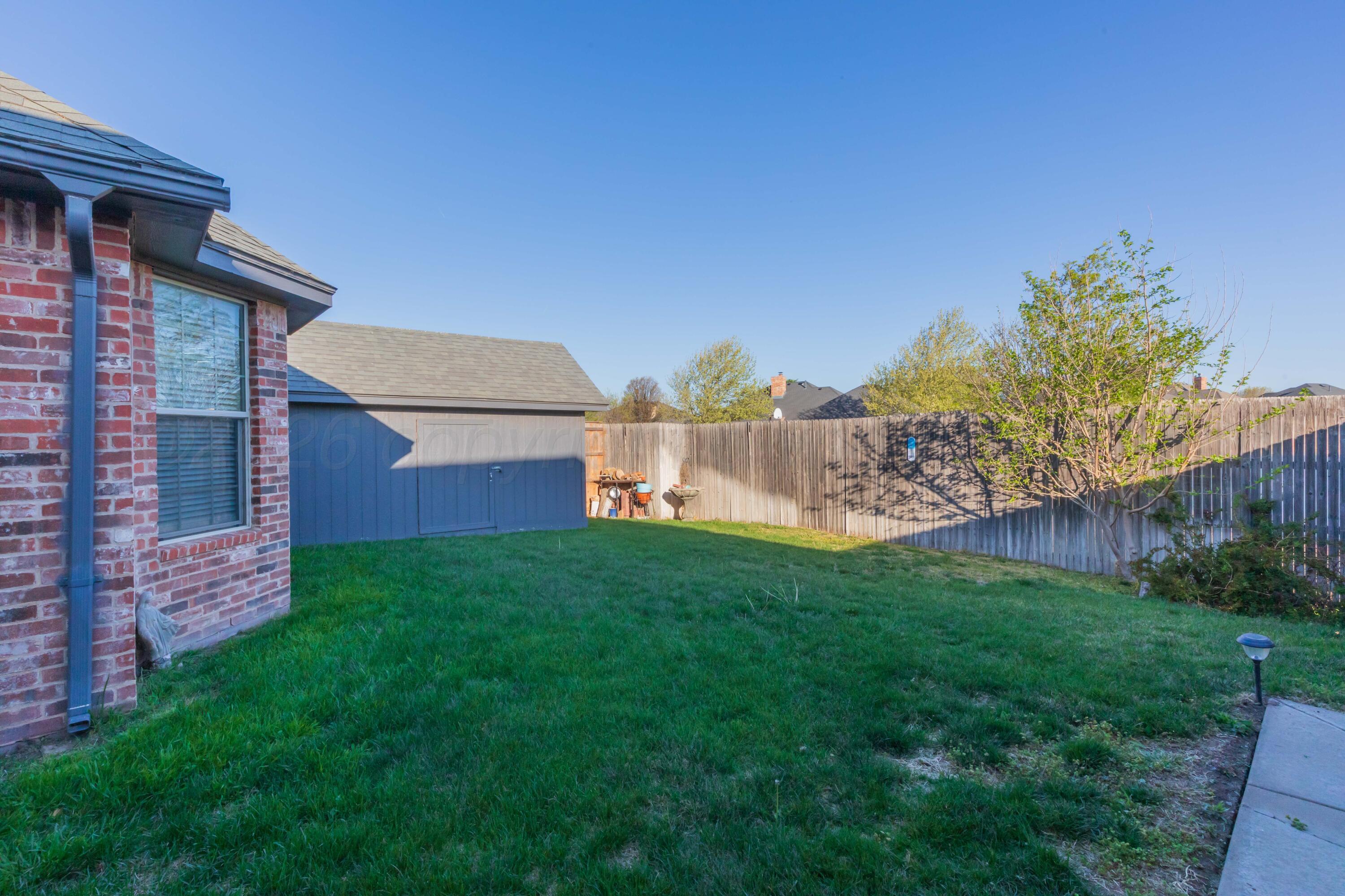 7718 Pinnacle Drive Amarillo, TX 79119 - Photo 62 of 66 a backyard of a house with lots of green space