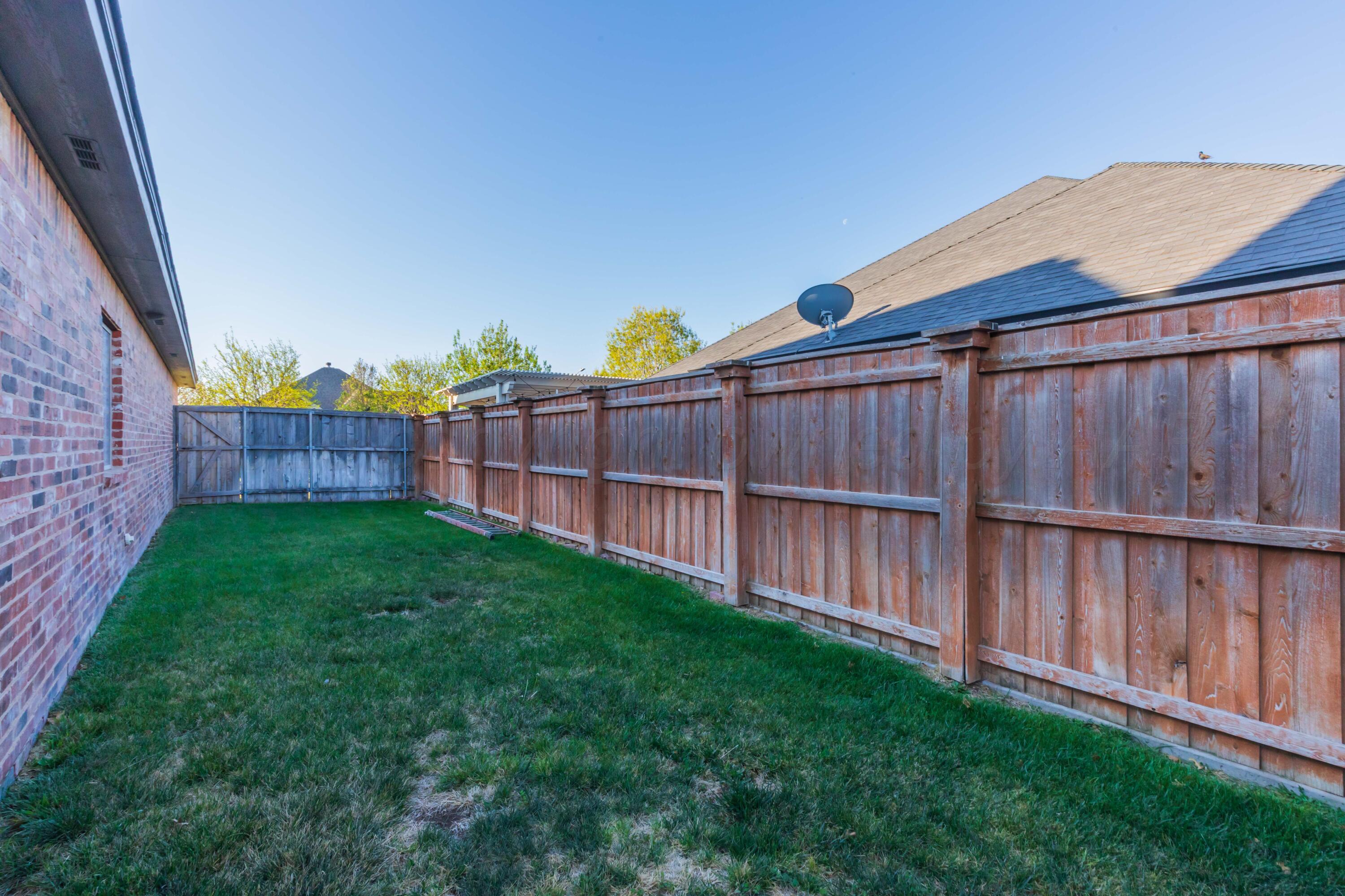 7718 Pinnacle Drive Amarillo, TX 79119 - Photo 63 of 66 a view of backyard with wooden fence