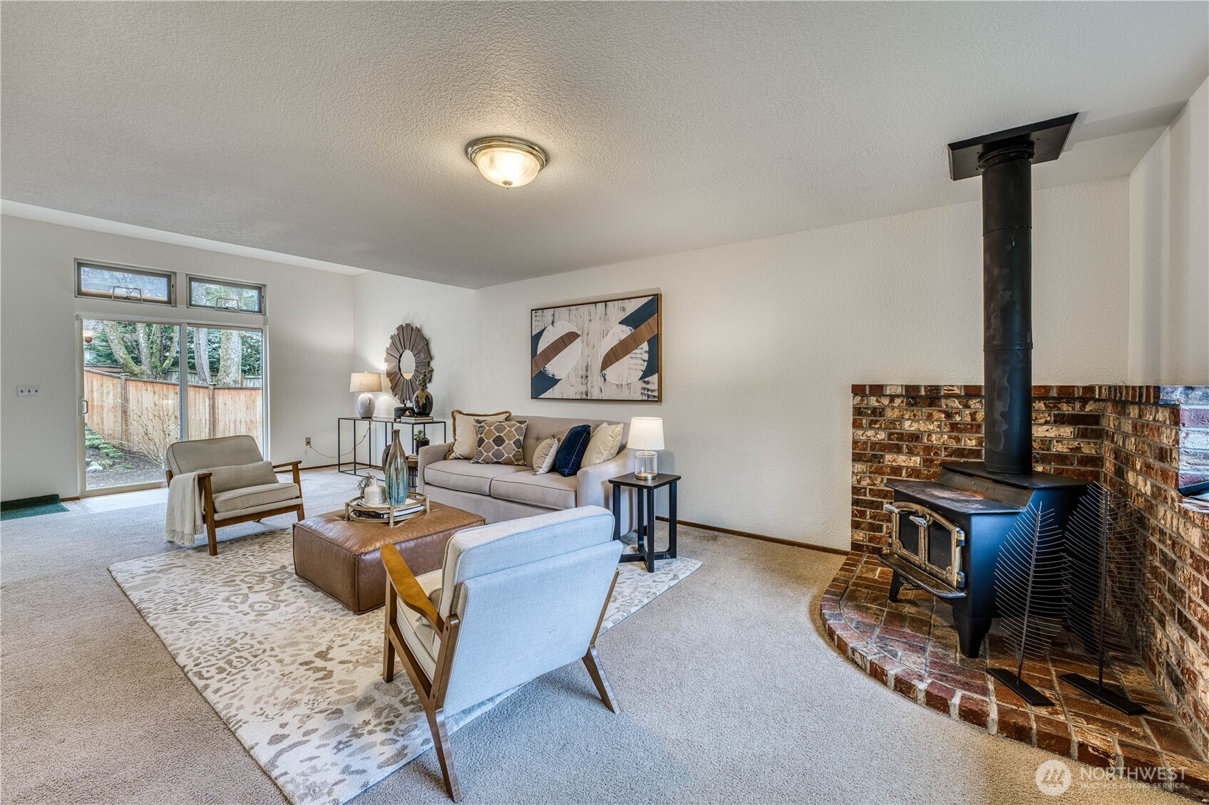 23823 90th Place West Edmonds, WA 98026 - Photo 11 of 40 a living room with furniture a flat screen tv and a table