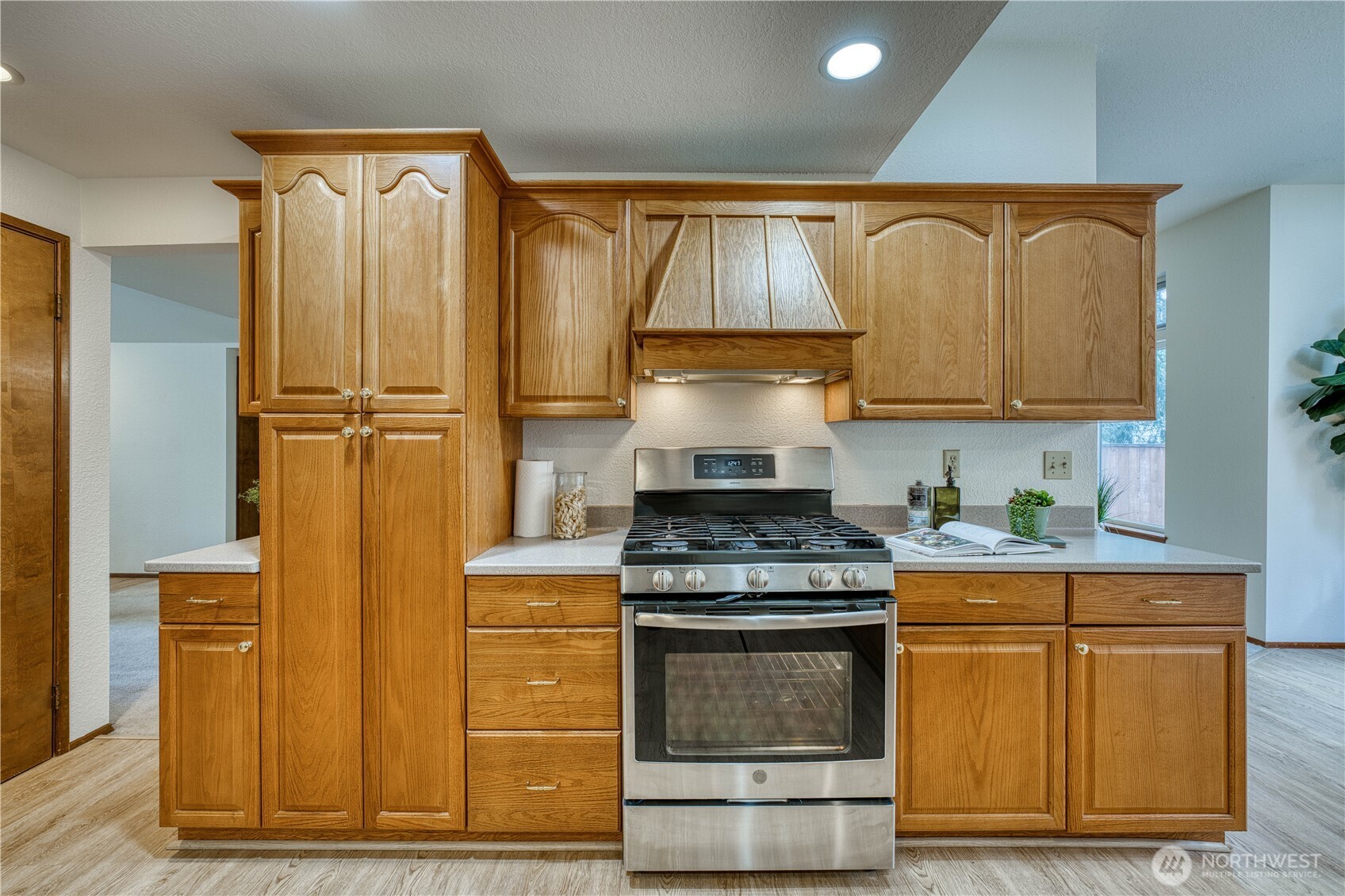 23823 90th Place West Edmonds, WA 98026 - Photo 17 of 40 a kitchen with stainless steel appliances granite countertop a stove and a refrigerator